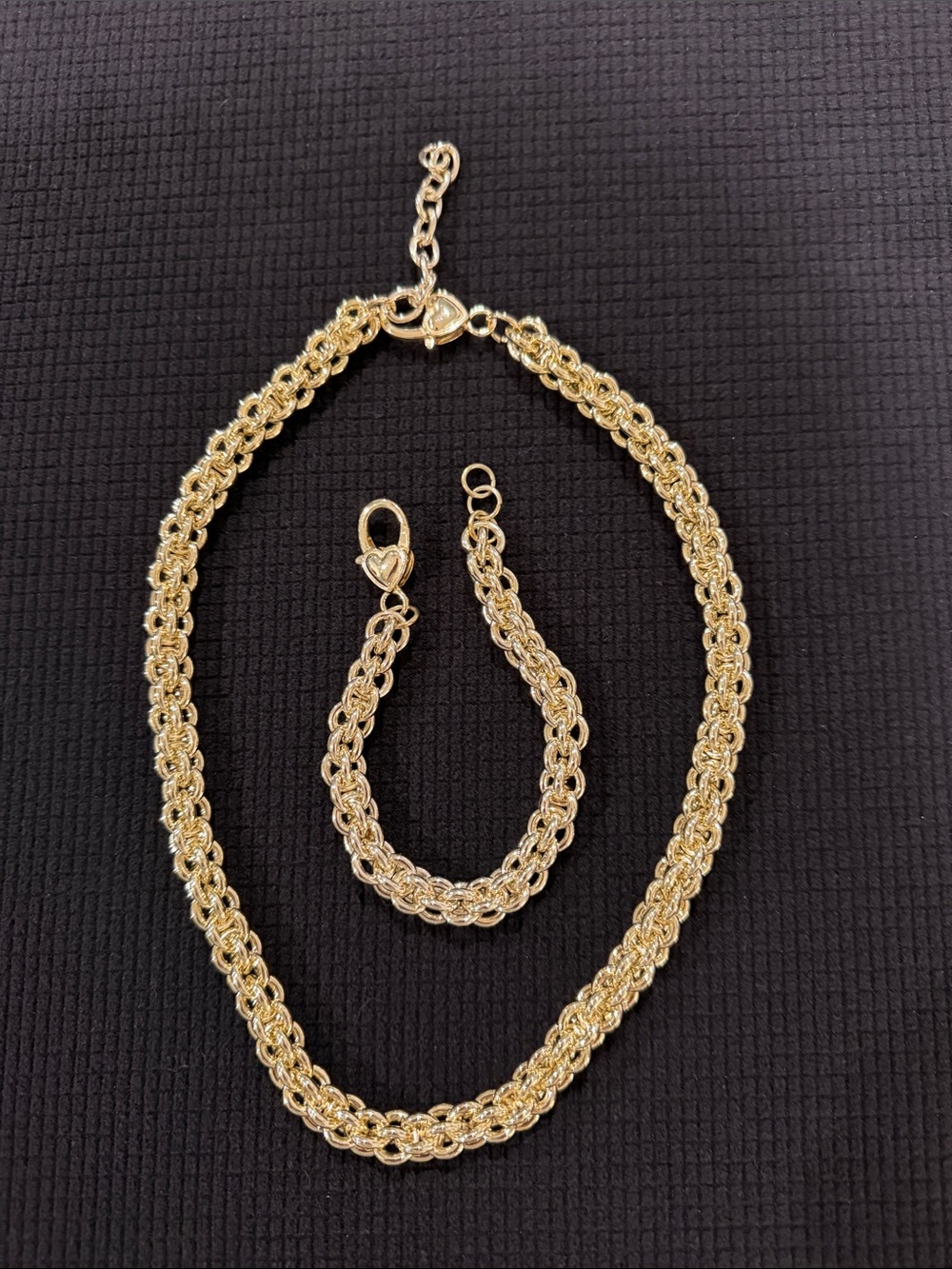 Gold plated bracelet and necklace with heart clasp.